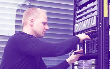 man working on computer servers